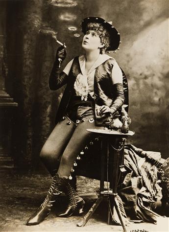 (HOLY SMOKE!) A selection of 27 photographs of people and animals smoking from glamorous flappers to pipe-smoking canines.